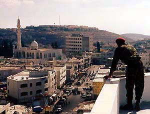 Photo: Palestinian Policeman overlooks Ramallah